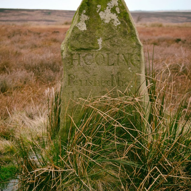 A lonely memorial stone in the middle of the moor. The inscription reads H COLING Perished here January 27 1848